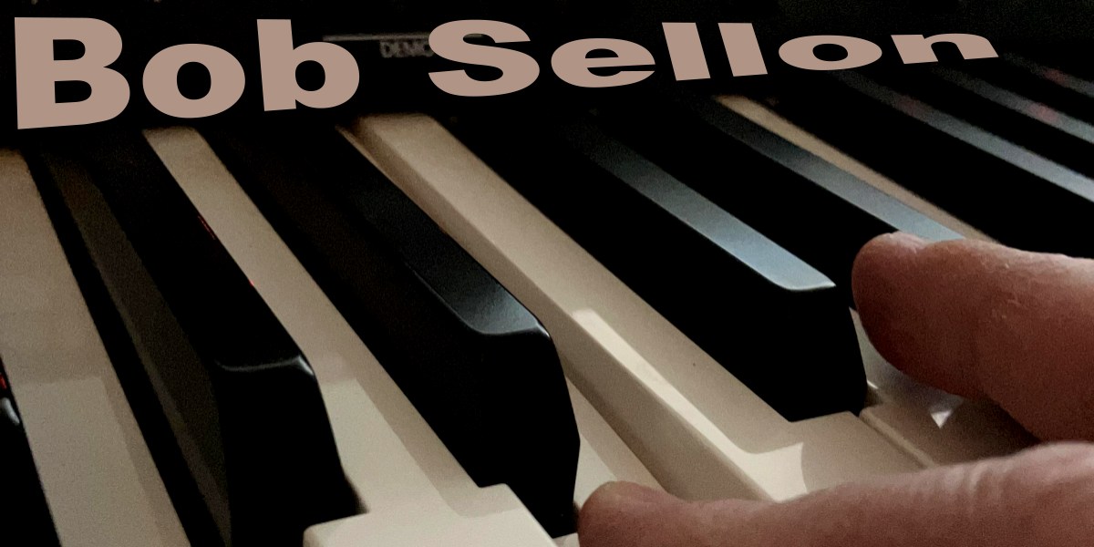 Fingers on a piano for Bob Sellons music 