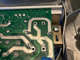 The circuit board with the old capacitors removed and the holes cleaned. 